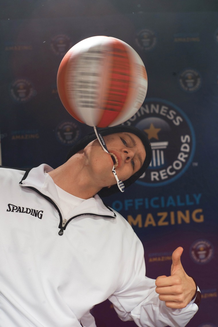 The longest duration spinning a basketball on a toothbrush is 26.078 seconds and was set by Michael Kopp (Germany) at Fliegende Bauten in Hamburg, Germany, on 14 November 2012 to celebrate Guinness World Records Day.
This was the first (and successful) try ever to set a world record for 18-years-old basketball-freestyler Michael Kopp, when he doubled the time of the previous record. His reason for participating in GWR day was that he wanted to be in the same line-up as his sporting idol Joe Alexander, who set two new world records in the same event.